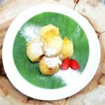 a plate of food on a wooden table